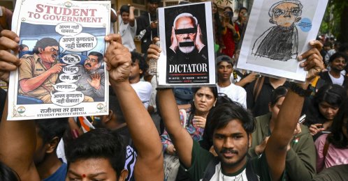 Demonstrators holding posters take part in a protest rally in Mumbai, India, July 24, 2026. (AFP Photo)