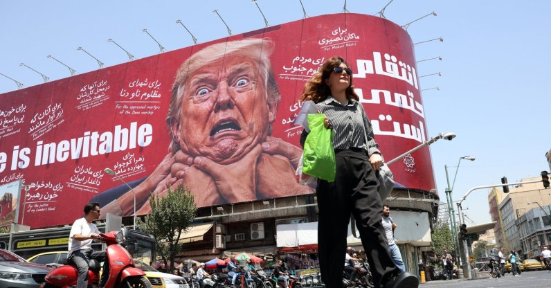 A woman walks past an anti-U.S. billboard in Tehran, Iran, July 27, 2026. (EPA Photo)