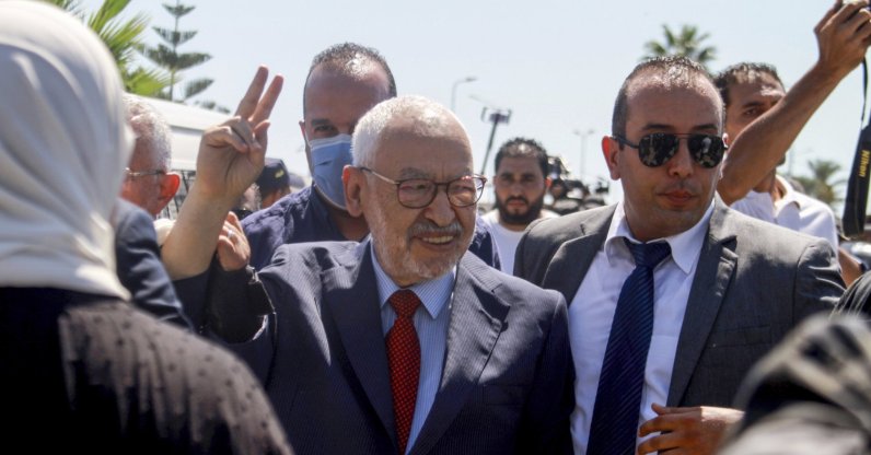 Leader of the Ennahdha party Rached Ghannouchi makes a sign as he arrives at Tunisia's anti-terrorism unit in Tunis, Tunisia, July 19, 2022. (AP Photo)