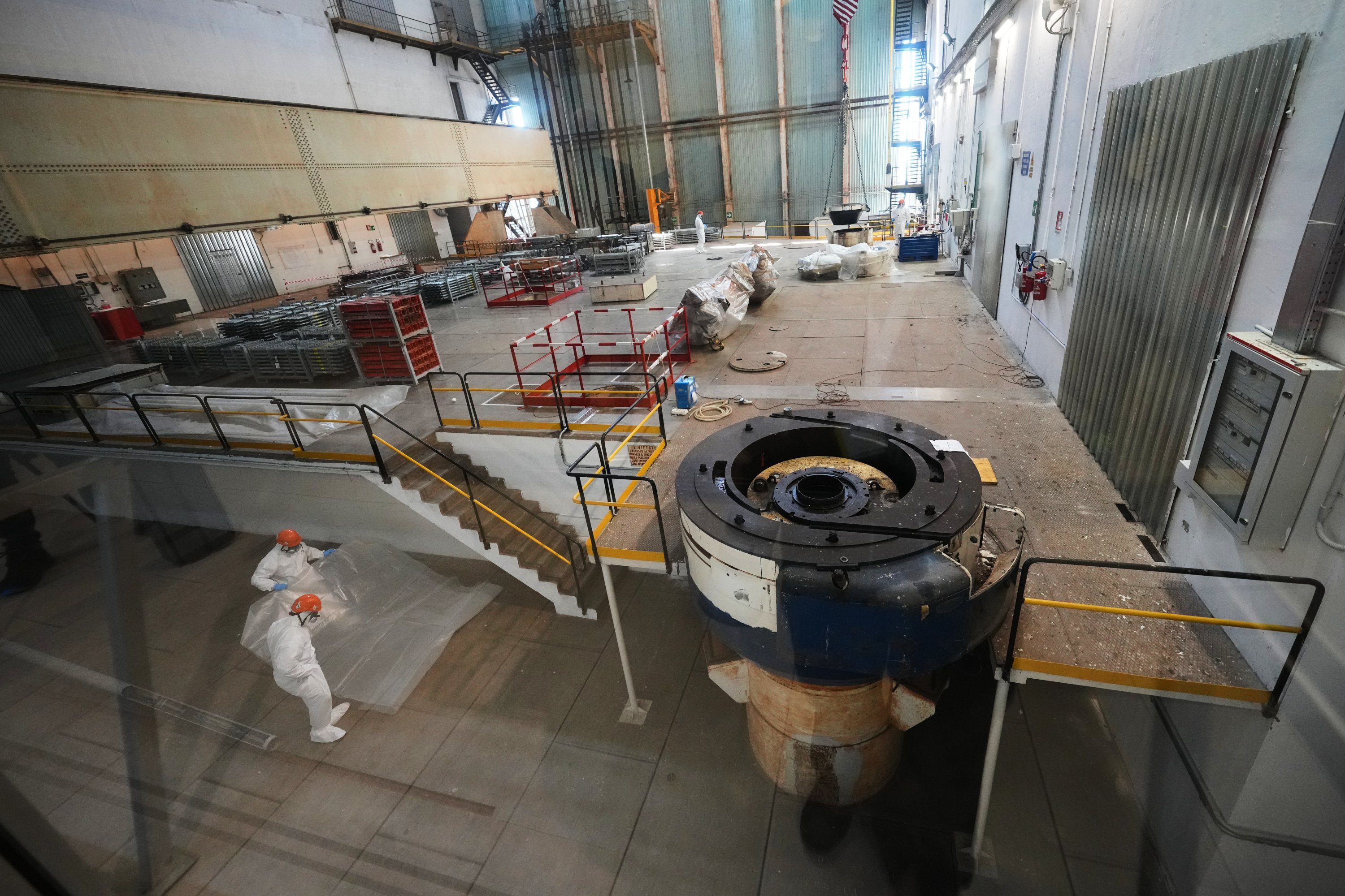 Workers package reactor components on the reactor operating floor of the former nuclear power plant of Latina, Italy, June 18, 2026. (AP Photo)