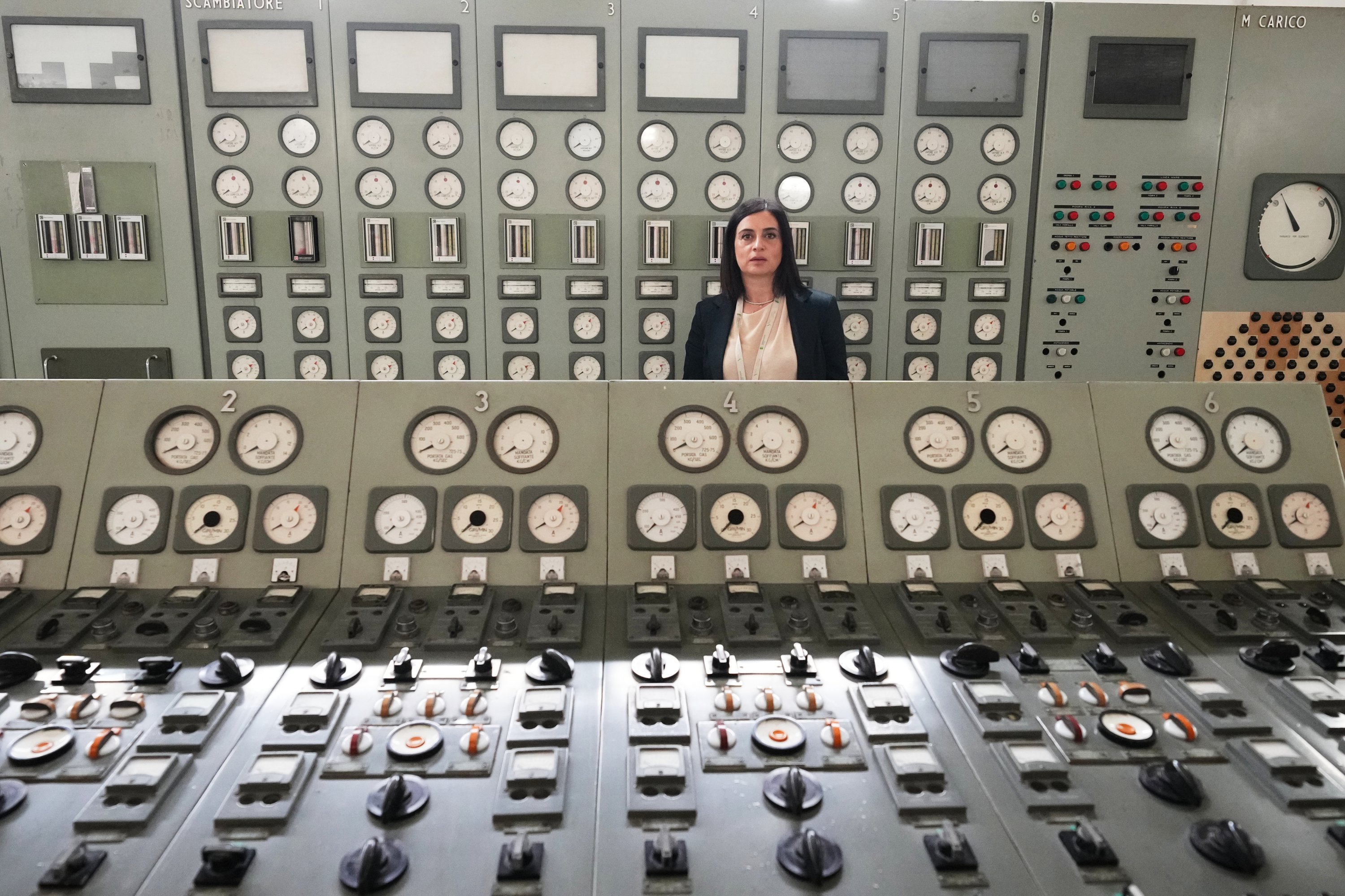 Viviana Cruciani, who oversees nuclear decommissioning of the former nuclear power plant of Latina, poses for a photo in the old control room, Latina, Italy, June 18, 2026. (AP Photo)