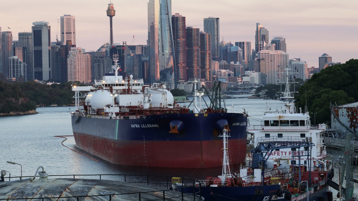Hafnia Lillesand, a crude oil and product tanker, sits at Viva Energy Australia's Gore Bay fuel terminal overlooking the city skyline, Sydney, Australia, April 14, 2026. (Reuters Photo)