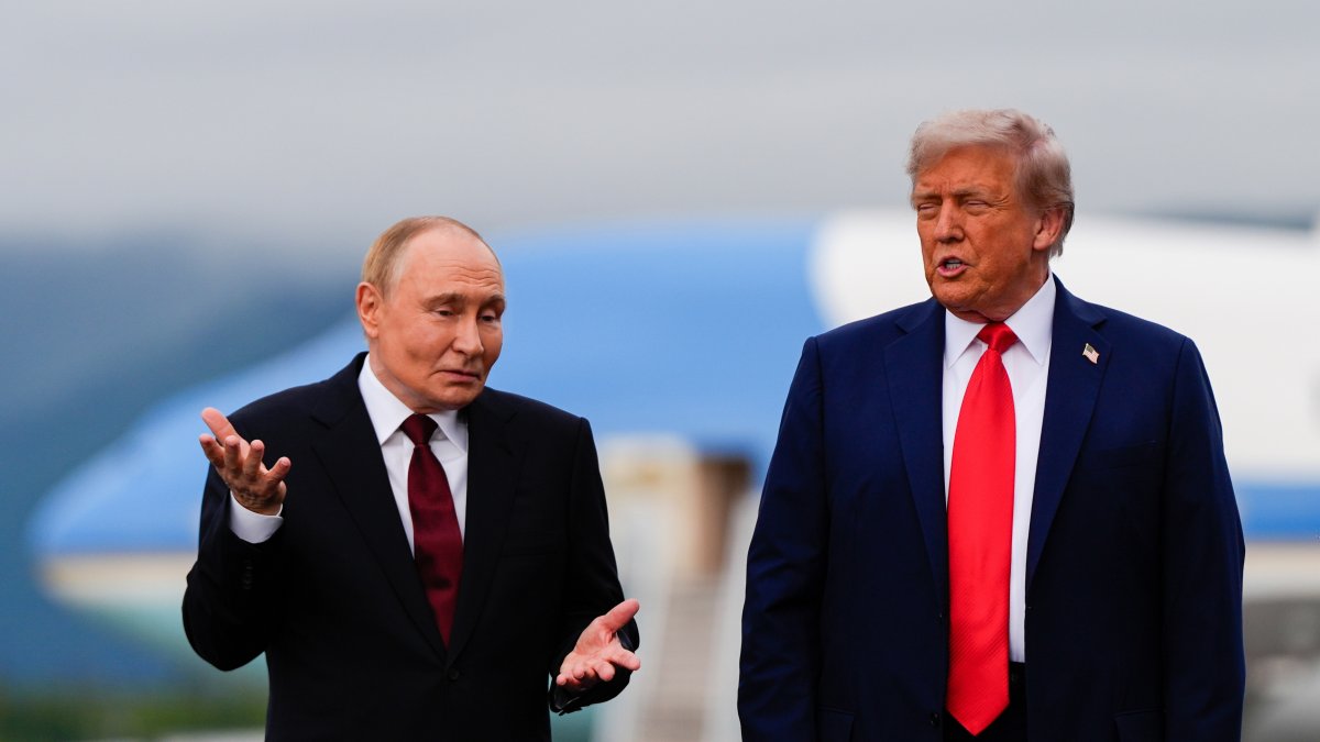 U.S. President Donald Trump and Russian President Vladimir Putin talk at Joint Base Elmendorf-Richardson, Alaska, U.S., Aug. 15, 2025. (AP Photo)