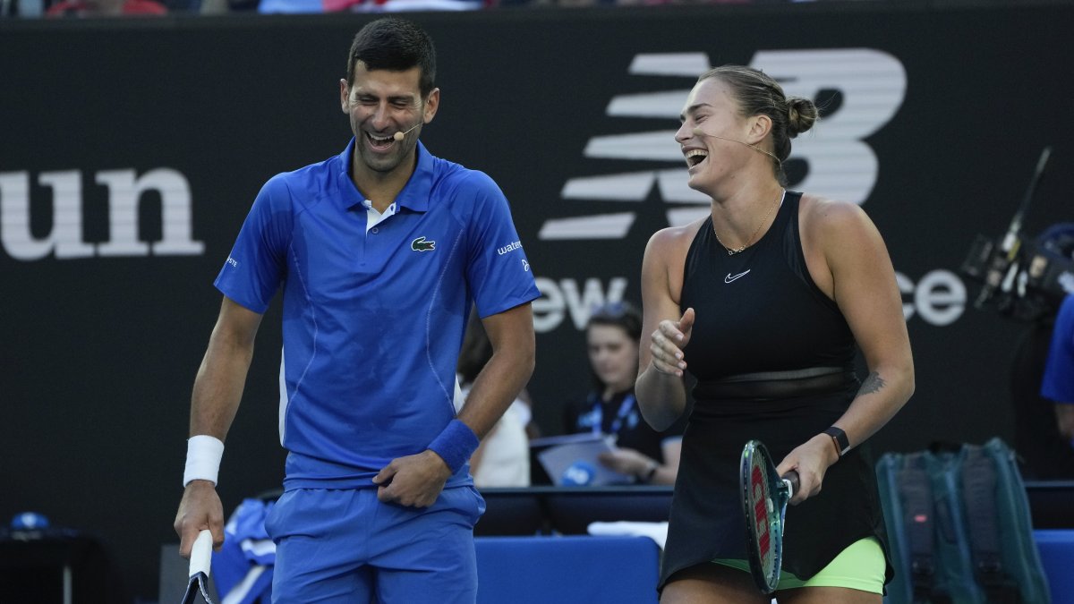 Serbia's Novak Djokovic and Belarus' Aryna Sabalenka react during an exhibition match against Greece's Stefanos Tsitsipas and Maria Sakkari ahead of the Australian Open tennis championships at Melbourne Park, Melbourne, Australia, Jan. 11, 2024. (AP Photo)