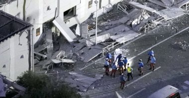 This aerial image shows rescue workers continuing the search at the damaged AEON Mall after an earthquake in Kashima, Kumamoto prefecture, southern Japan, July 28, 2026. (AP Photo)