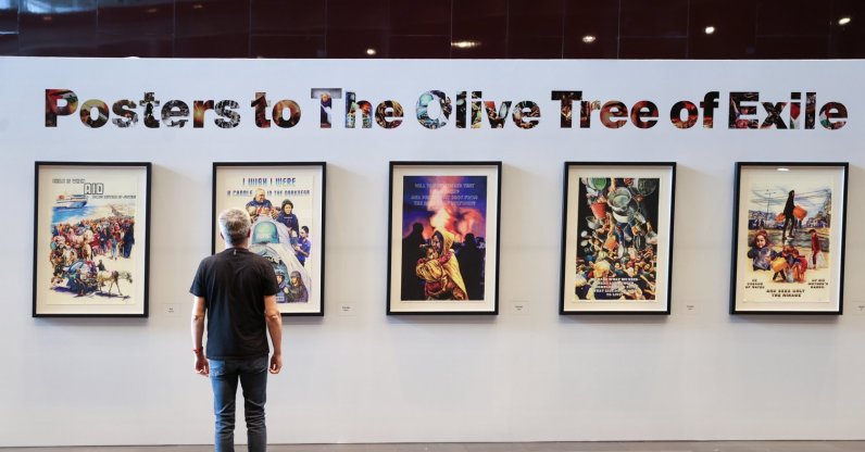 A visitor views Turkish artist Ahmet Yusuf Aygeç's exhibition, "Posters for the Olive Tree in Exile," at the Mahmoud Darwish Museum in Ramallah, the occupied West Bank, Palestine, July 26, 2026. (AA Photo)