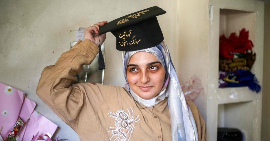 Palestinian high school student Saba Rabah, the top-ranked student in the science stream of the Palestinian national high school exams, celebrates with family at the Maghazi camp for Palestinian refugees in the central Gaza Strip, July 26, 2026. (AFP Photo)
