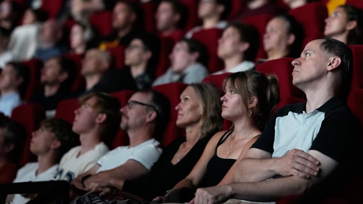 Spectators view the 70 mm IMAX copy of Christopher Nolan's "The Odyssey," Prague, Czechia, July 27, 2026. (AP Photo)
