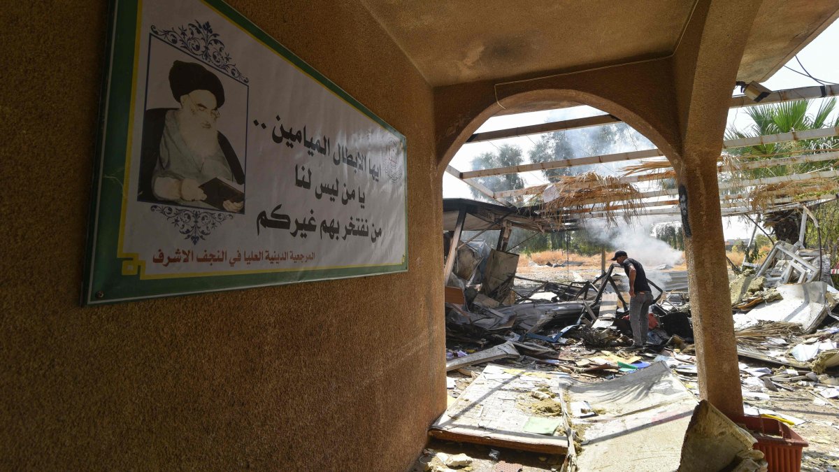A man inspects the damage at the site of a strike in Bartalla in the Nineveh province, northern Iraq, July 29, 2026. (AFP Photo)
