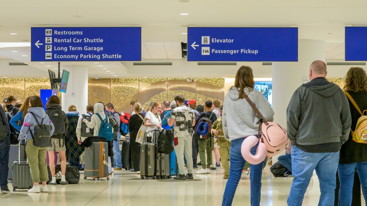 Airline passengers waiting for their luggage to arrive in the baggage claim area of the Louis Armstrong International Airport, New Orleans, U.S., March 16, 2026. (Shutterstock Photo)