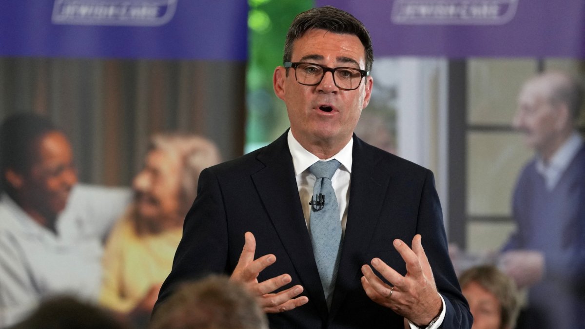 Britain's Prime Minister Andy Burnham speaks to residents, care workers, volunteers and social care stakeholders during a care home visit in London, Wednesday, July 29, 2026.  (Reuters Photo)