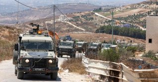 Israeli soldiers in their vehicles patrol the road in the Palestinian village of Tell, in the Israeli-occupied West Bank, July 25, 2026. (AFP Photo)