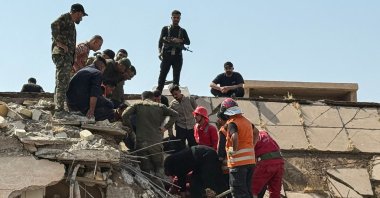 Security forces and emergency personnel work at the site of a strike in Dayala, Iraq, July 29, 2026. (AFP Photo)