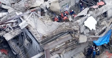 This aerial image shows a rescue operation at the Nippon Paper Industries Co.’s Yatsushiro factory, following an earthquake in Yatsushiro, Kumamoto Prefecture, July 29, 2026. (AP Photo)