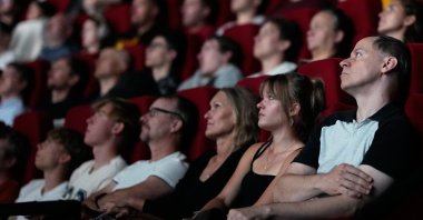 Spectators view the 70 mm IMAX copy of Christopher Nolan's "The Odyssey," Prague, Czechia, July 27, 2026. (AP Photo)