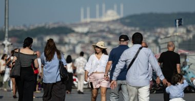 Residents and tourists make their way through Eminönü, Istanbul, Türkiye, July 28, 2026. (AA Photo) 