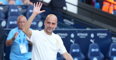 Manchester City's head coach Pep Guardiola waves to the fans after the last game with the club after a Premier League match between Manchester City and Aston Villa, Manchester, England, May 24, 2026. (AP Photo)