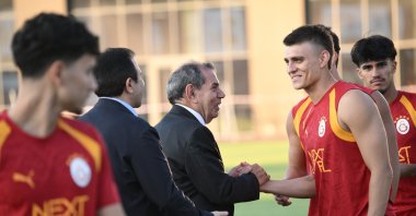 Galatasaray President Dursun Özbek (C) greets players at Kemerburgaz Metin Oktay Facilities, Istanbul, Türkiye, July 7, 2026. (AA Photo)