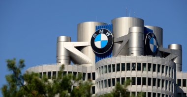 The company's logo is seen atop the so-called BMW tower, the global corporate headquarters of German carmaker BMW, Munich, southern Germany, July 16, 2026. (AFP Photo)