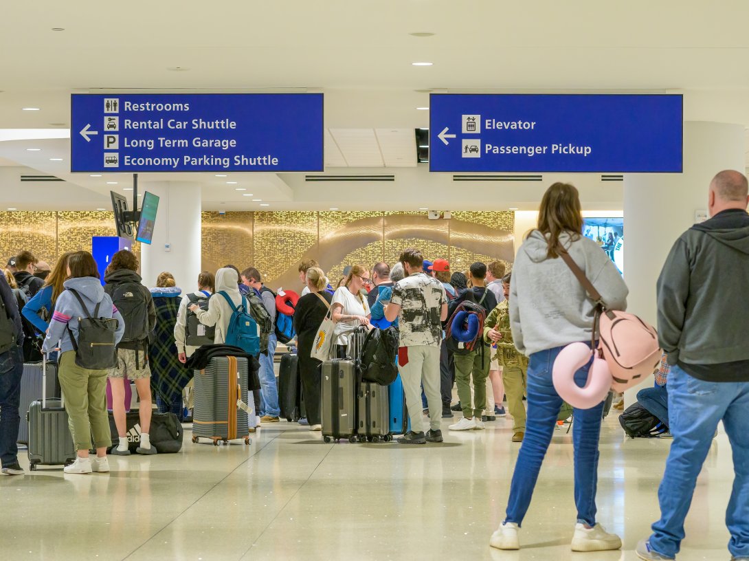 Airline passengers waiting for their luggage to arrive in the baggage claim area of the Louis Armstrong International Airport, New Orleans, U.S., March 16, 2026. (Shutterstock Photo)