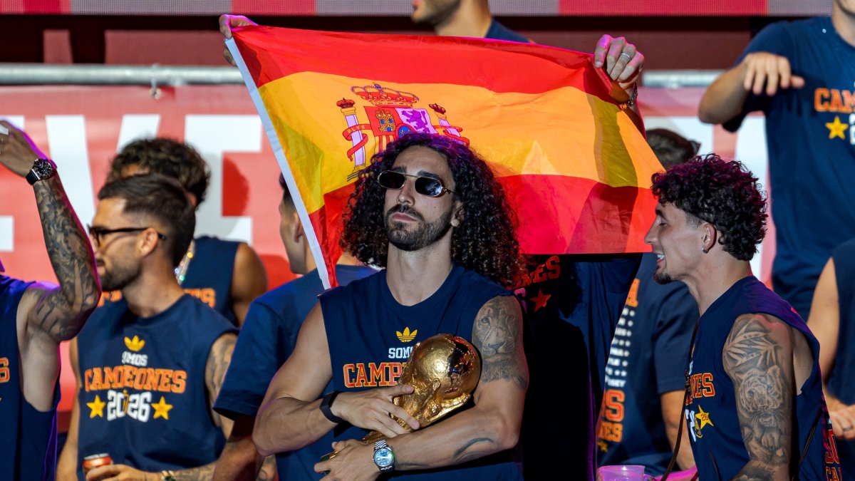 Spain's Marc Cucurella (C) holds the World Cup trophy during the 2026 FIFA World Cup victory celebration parade, Madrid, Spain, July 20, 2026. (AA Photo)