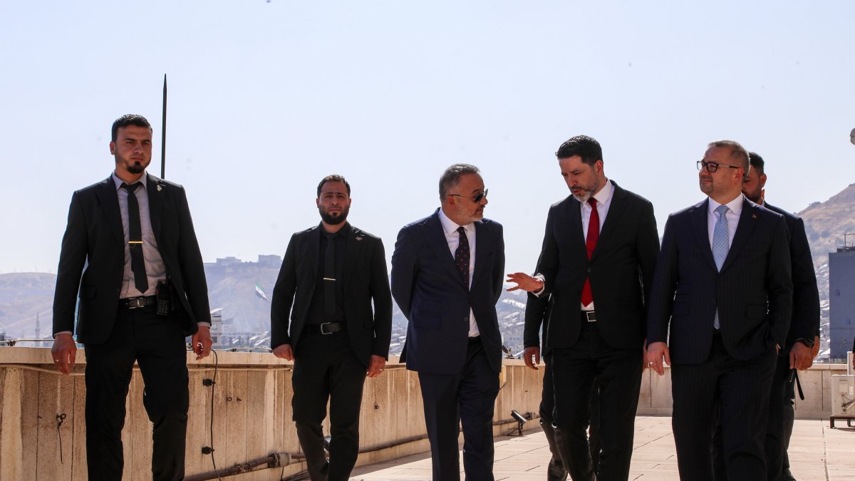 Central Bank of the Republic of Türkiye Gov. Fatih Karahan (R) and Türkiye's Ambassador to Syria Nuh Yılmaz (3rd L) are welcomed by Syrian officials during their visit to Damascus, Syria, July 30, 2026. (AA Photo)