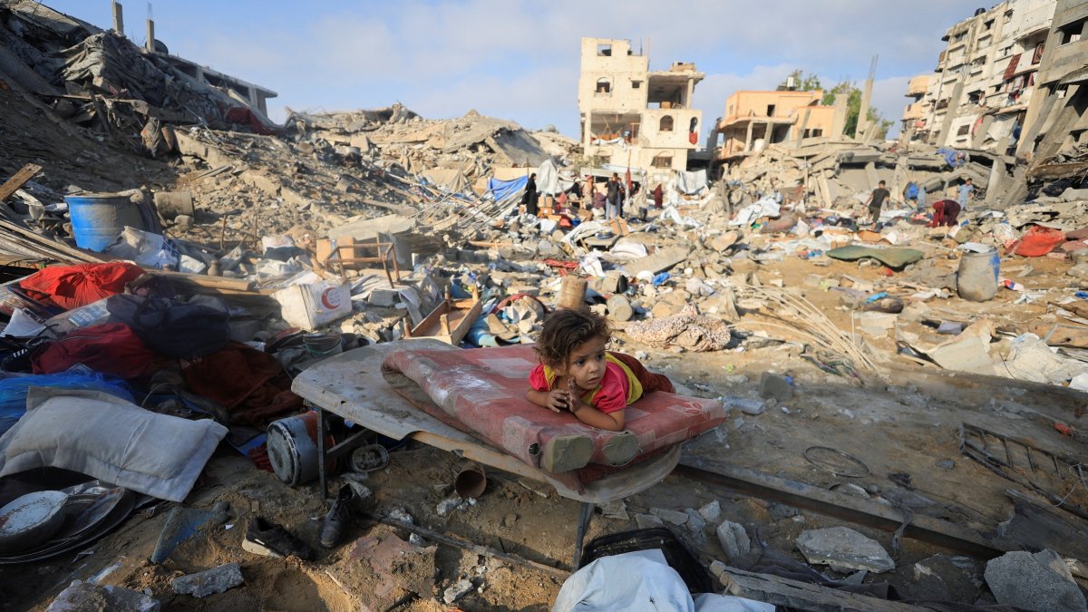 A Palestinian child lies on a damaged mattress at the site of an Israeli strike in Gaza City, Palestine, July 30, 2026. (Reuters Photo)