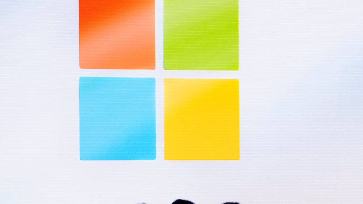 A Microsoft logo is seen on a screen as people listen at an event at Microsoft headquarters, Redmond, Washington, U.S., May 20, 2024. (AP Photo)