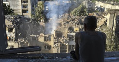 A man looks at the site of a Russian missile strike on a residential building in Lviv, western Ukraine, July 30, 2026. (EPA Photo)
