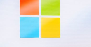 A Microsoft logo is seen on a screen as people listen at an event at Microsoft headquarters, Redmond, Washington, U.S., May 20, 2024. (AP Photo)