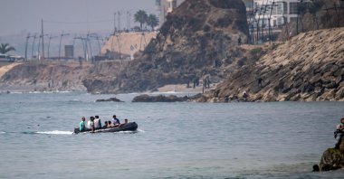 Migrants try to cross into the Spanish enclave of Ceuta aboard a boat off the coast of Morocco, July 30, 2026. (AP Photo)