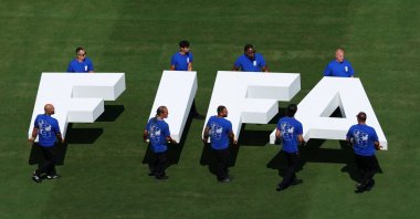 Pitch staff carries the FIFA logo on the pitch before the FIFA World Cup 2026 final, New Jersey, U.S., July 19, 2026. (Reuters Photo)