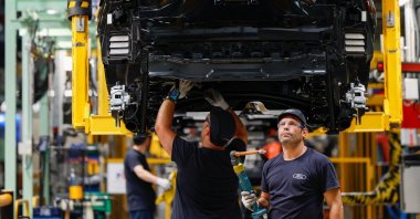 Men work on the assembly line at the Ford factory in Almusafes, near Valencia, Spain, July 23, 2026. (Reuters Photo)