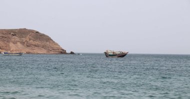 A photo taken from the Yemeni coast southwest of the city of Taiz, shows boats floating at Bab al-Mandab Strait, in the Red Sea, on July 24, 2026. (AFP Photo)