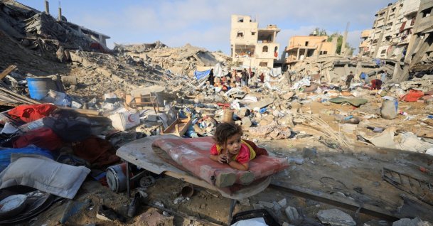 A Palestinian child lies on a damaged mattress at the site of an Israeli strike in Gaza City, Palestine, July 30, 2026. (Reuters Photo)