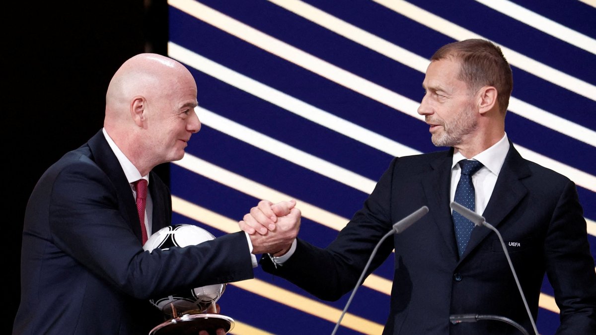 UEFA president Aleksander Ceferin and FIFA president Gianni Infantino shake hands during the 50th Ordinary UEFA Congress at Brussels Expo, Brussels, Belgium, Feb. 12, 2026. (Reuters Photo)