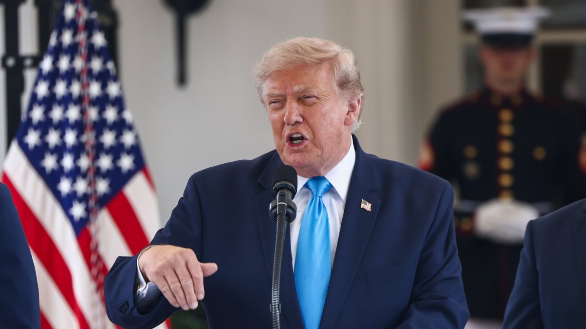 U.S. President Donald Trump announces a program to allow veterans to expedite a career in commercial trucking outside the White House, Washington, U.S., July 30, 2026. (EPA Photo)