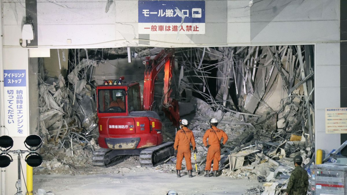 Heavy machinery removes debris at AEON Mall, which was damaged by an explosion following an earthquake, Kashima, Kumamoto Prefecture, Japan July 31, 2026. (AP Photo)