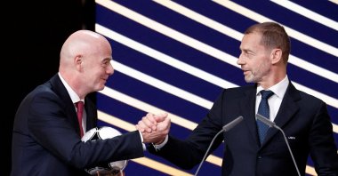UEFA president Aleksander Ceferin and FIFA president Gianni Infantino shake hands during the 50th Ordinary UEFA Congress at Brussels Expo, Brussels, Belgium, Feb. 12, 2026. (Reuters Photo)