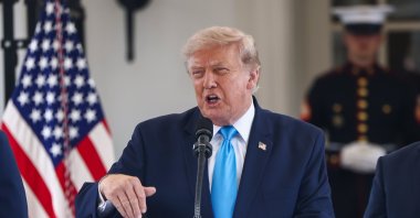 U.S. President Donald Trump announces a program to allow veterans to expedite a career in commercial trucking outside the White House, Washington, U.S., July 30, 2026. (EPA Photo)