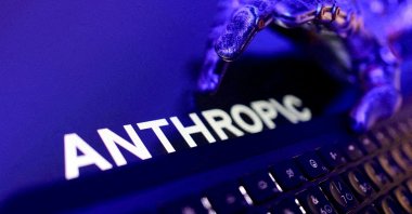 Anthropic logo, a keyboard, and a robotic hand in this illustration created June 5, 2026. (Reuters Photo)