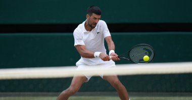 Serbia's Novak Djokovic returns a shot during his semifinal match against Italy's Jannik Sinner on day 12 at All England Lawn Tennis and Croquet Club, London, U.K., July 10, 2026. (Reuters Photo)