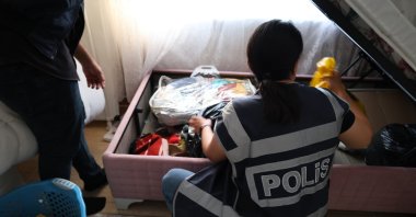 Police officers search a house during an operation targeting illegal betting and money-laundering networks, Mersin, Türkiye, July 26, 2026. (AA Photo)