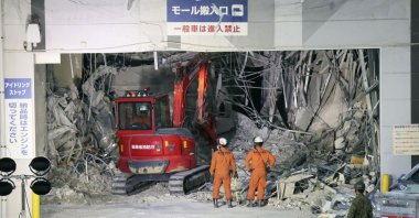 Heavy machinery removes debris at AEON Mall, which was damaged by an explosion following an earthquake, Kashima, Kumamoto Prefecture, Japan July 31, 2026. (AP Photo)