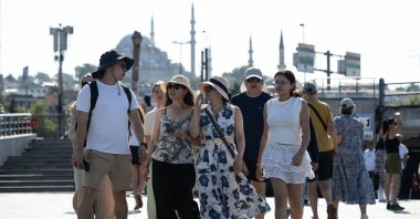 Tourists walk in the famous Eminönü neighborhood, Istanbul, Türkiye, July 28, 2026. (AA Photo)