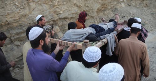 Rescue workers and locals carry the body of a victim after a coal mine blast on the outskirts of Quetta, Pakistan, July 30, 2026. (EPA Photo)