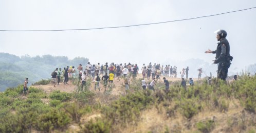 Young men who returned from Spain gather at the Bab Sebta border crossing near Fnideq, Morocco, July 31, 2026. (EPA Photo)