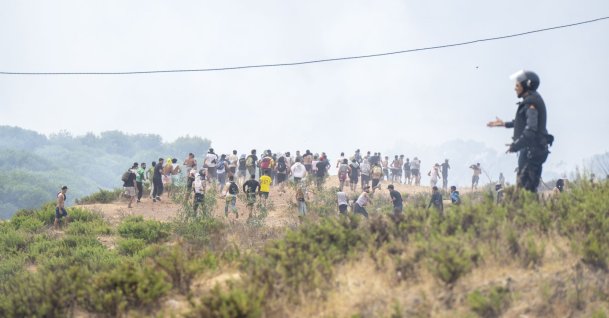 Young men who returned from Spain gather at the Bab Sebta border crossing near Fnideq, Morocco, July 31, 2026. (EPA Photo)