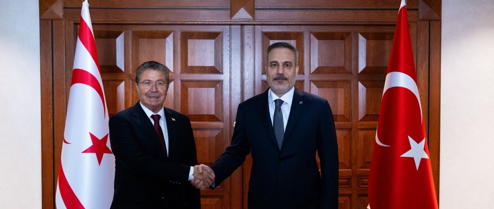Foreign Minister Hakan Fidan shakes hands with TRNC Prime Minister Ünal Üstel in Ankara, July 31, 2026. (IHA Photo)