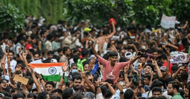 Cockroach Janta Party (CJP) supporters celebrate the resignation of India's Education Minister Dharmendra Pradhan at Jantar Mantar amid the ongoing protests over alleged NEET exam irregularities, New Delhi, India, July 25, 2026. (AFP Photo)